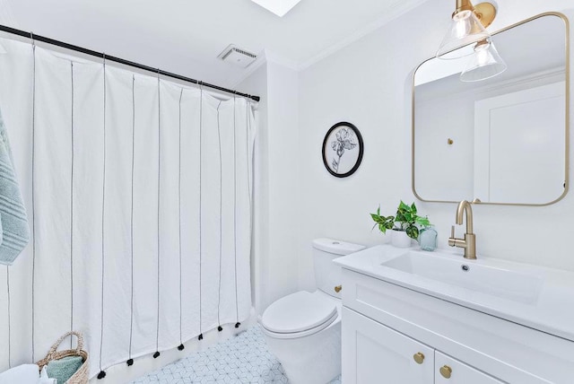 bathroom with ornamental molding, toilet, and vanity