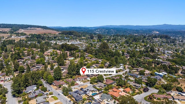 birds eye view of property featuring a mountain view