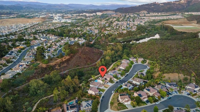 drone / aerial view featuring a mountain view