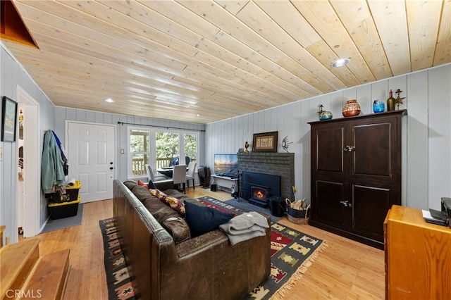 living room featuring wooden ceiling and light hardwood / wood-style flooring