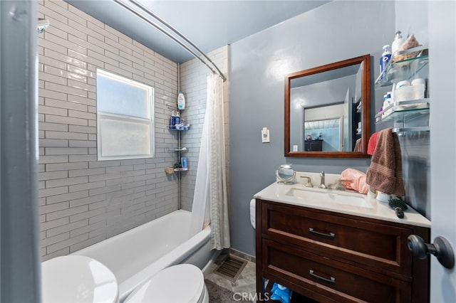 full bathroom with vanity, shower / bath combo, and toilet