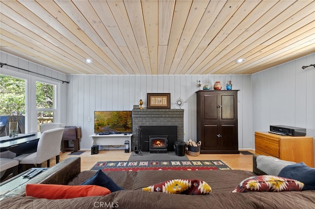 living room featuring wood ceiling, wood walls, and light hardwood / wood-style floors