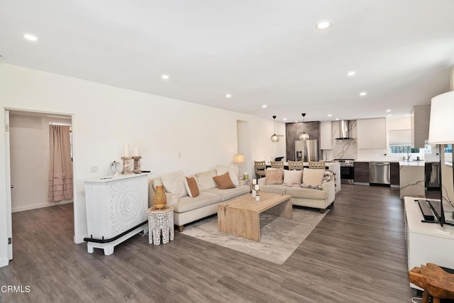 living room with dark hardwood / wood-style flooring