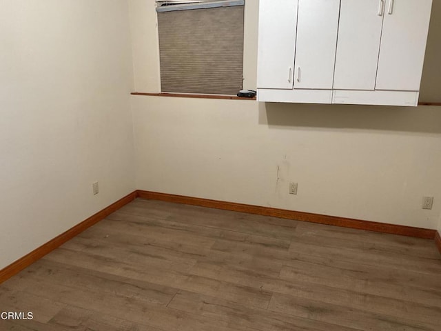 spare room with hardwood / wood-style floors