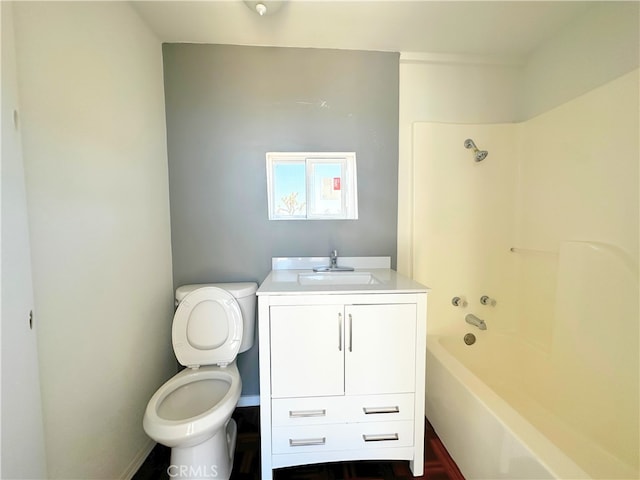 full bathroom featuring toilet, shower / bathing tub combination, and vanity