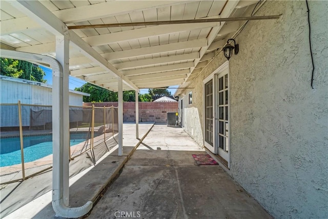 view of patio / terrace featuring a fenced in pool