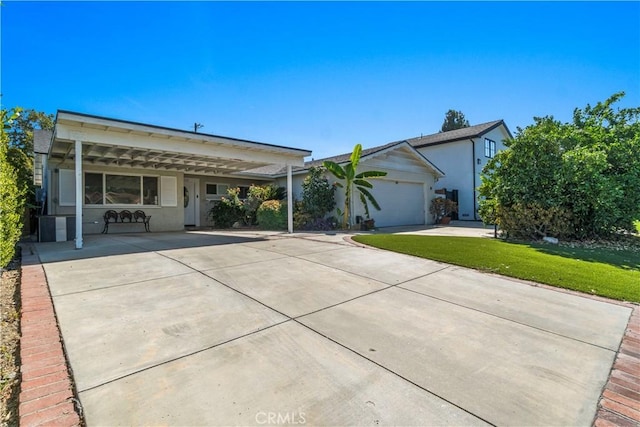 view of front of home with a garage and a front lawn