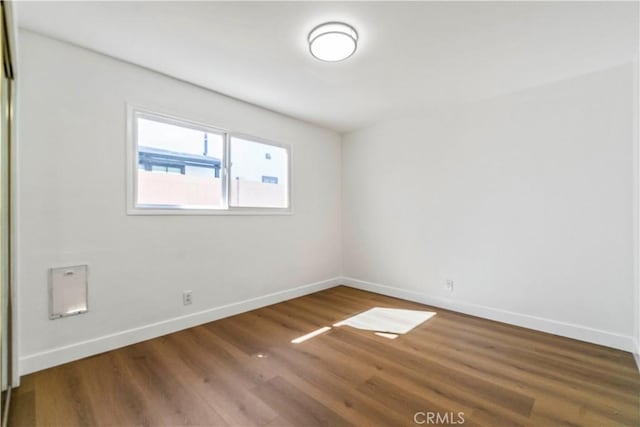 empty room featuring hardwood / wood-style flooring