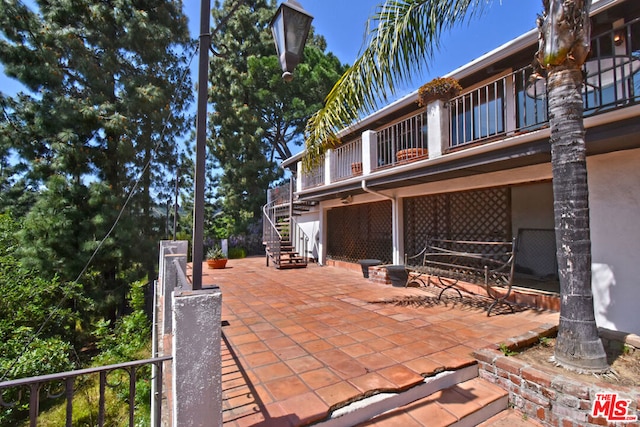 view of patio / terrace featuring a balcony