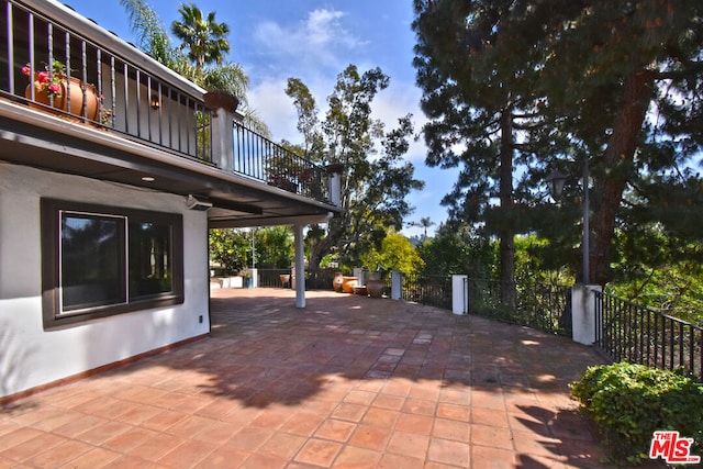 view of patio / terrace featuring a balcony