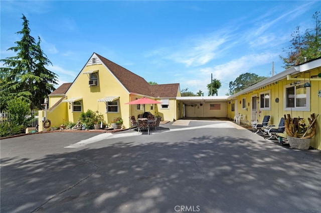 view of front of home with a carport