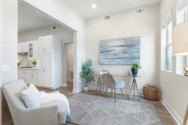 sitting room with light hardwood / wood-style flooring