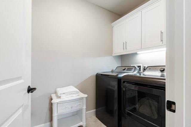 laundry area with cabinets and independent washer and dryer