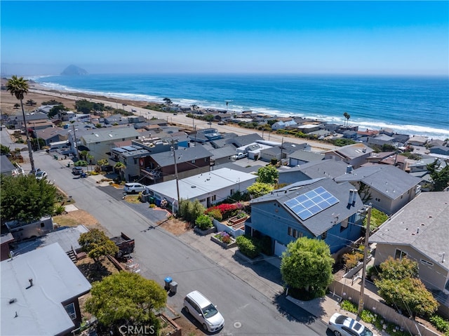 bird's eye view featuring a view of the beach and a water view