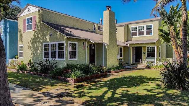 view of front of property with a front lawn