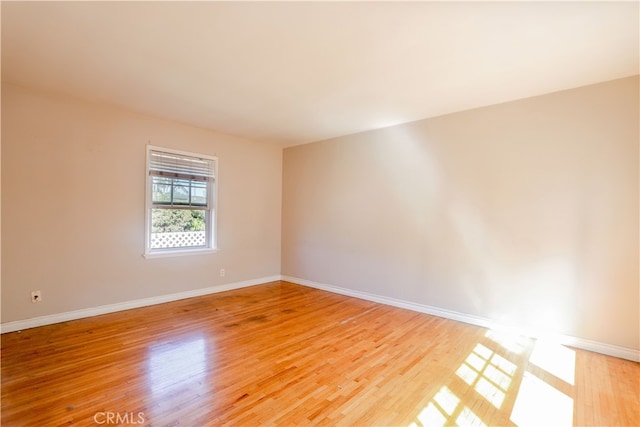 unfurnished room featuring light wood-type flooring