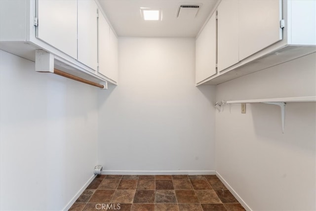 washroom with cabinets