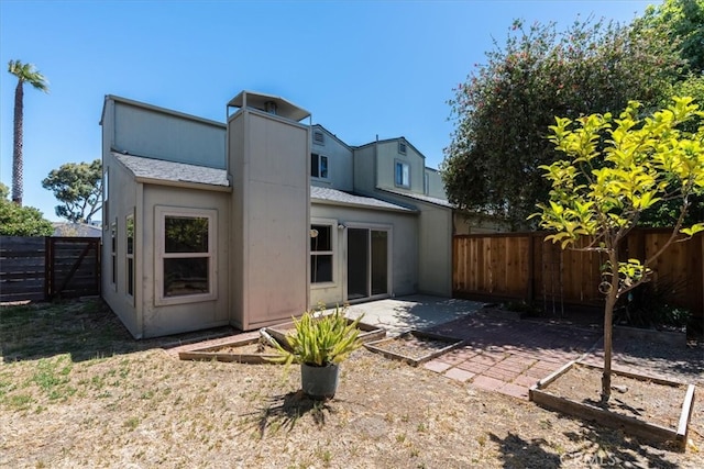 rear view of property with a patio