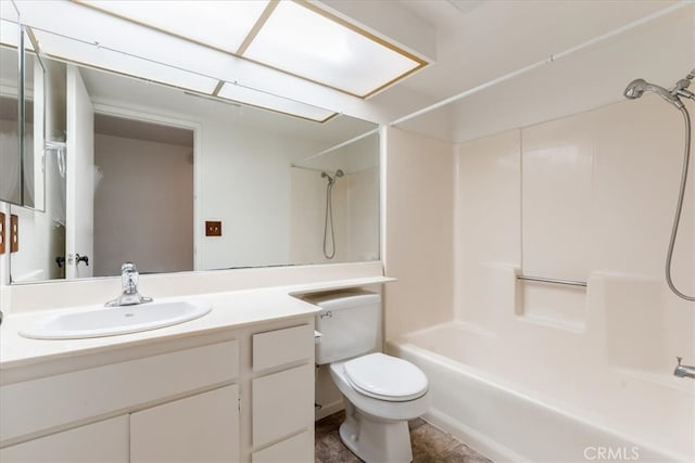 full bathroom featuring shower / washtub combination, vanity, and toilet