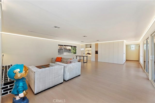 living room with light hardwood / wood-style floors