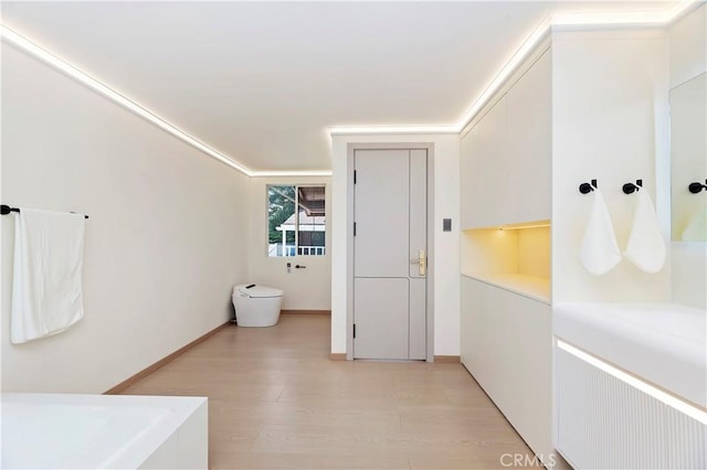 bathroom with hardwood / wood-style flooring