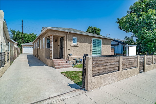 view of front of home with an outbuilding and a garage