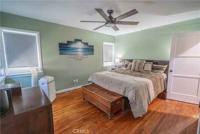 bedroom featuring ceiling fan and hardwood / wood-style floors