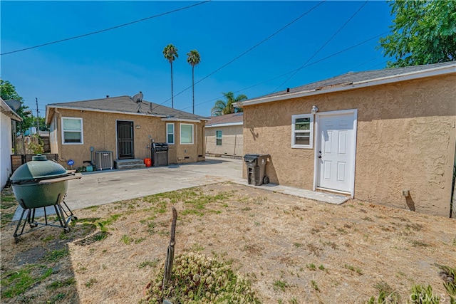 rear view of house with a patio