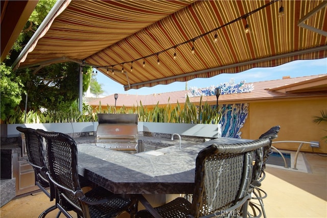 view of patio featuring a grill and exterior kitchen