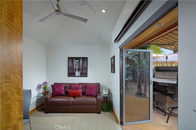 living room with ceiling fan and vaulted ceiling