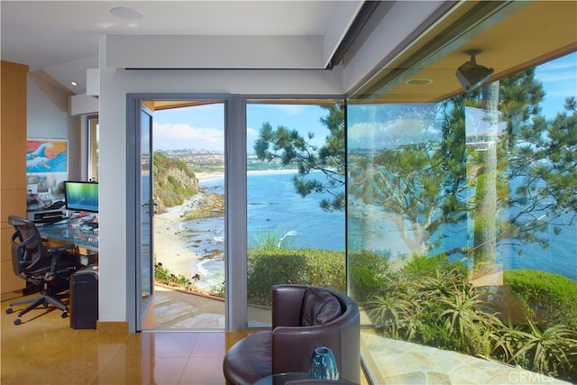 doorway to outside with light tile patterned flooring and a water view