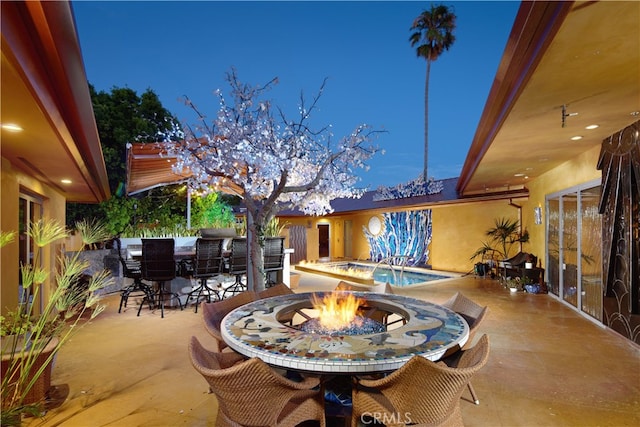 patio terrace at dusk with a jacuzzi