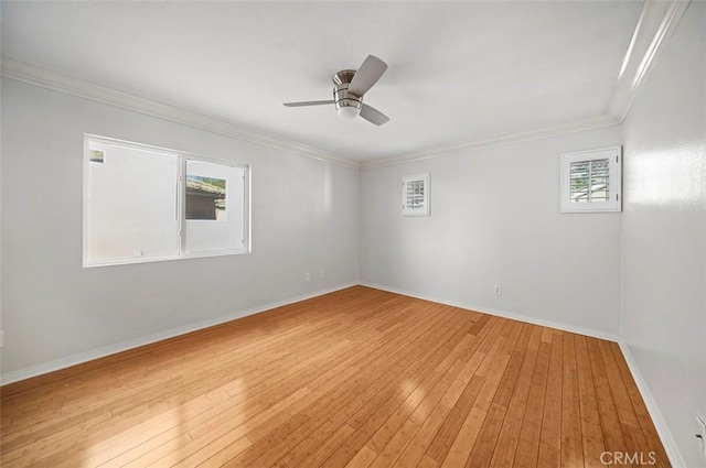 empty room with wood-type flooring, ceiling fan, and a healthy amount of sunlight