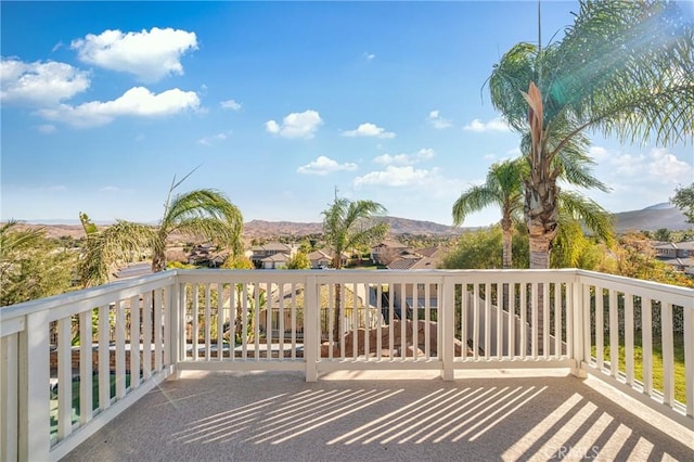 wooden deck with a mountain view