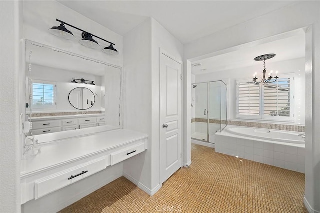 bathroom featuring tile patterned floors, vanity, independent shower and bath, and a notable chandelier