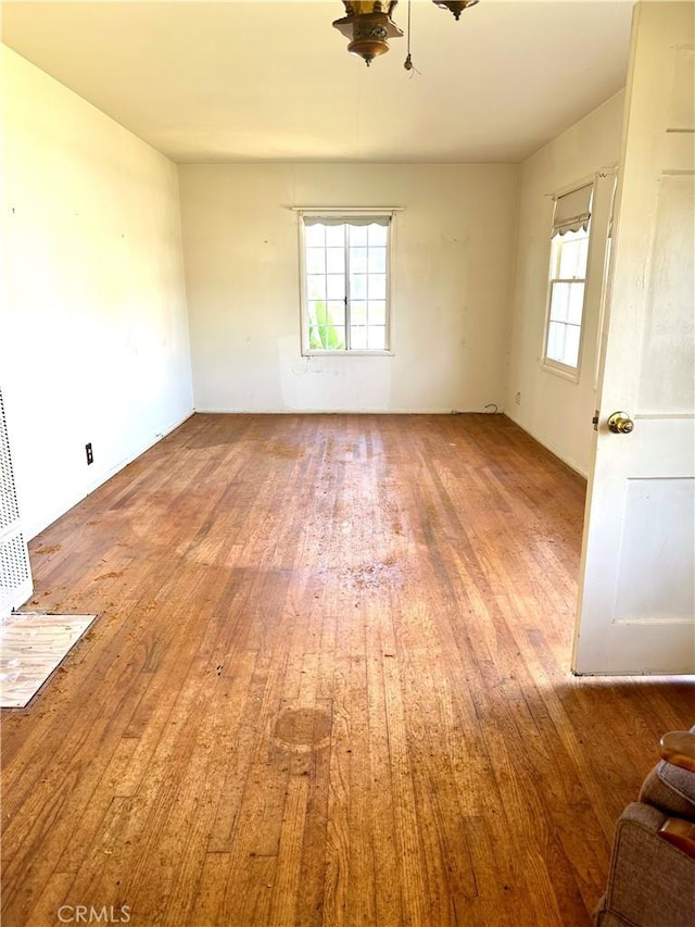 unfurnished room featuring wood finished floors