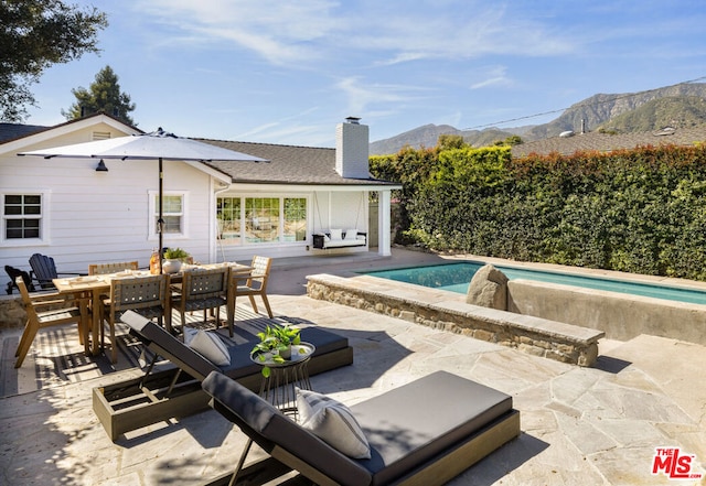 view of patio / terrace with a mountain view