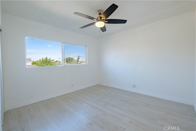 unfurnished room with light wood-type flooring and ceiling fan