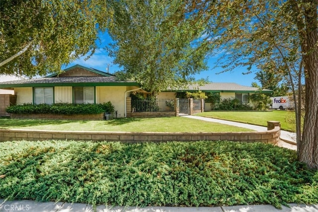 ranch-style house with a front yard