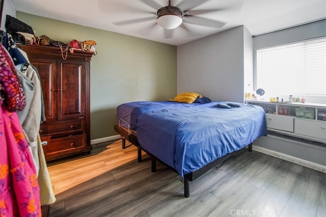 bedroom featuring wood-type flooring and ceiling fan