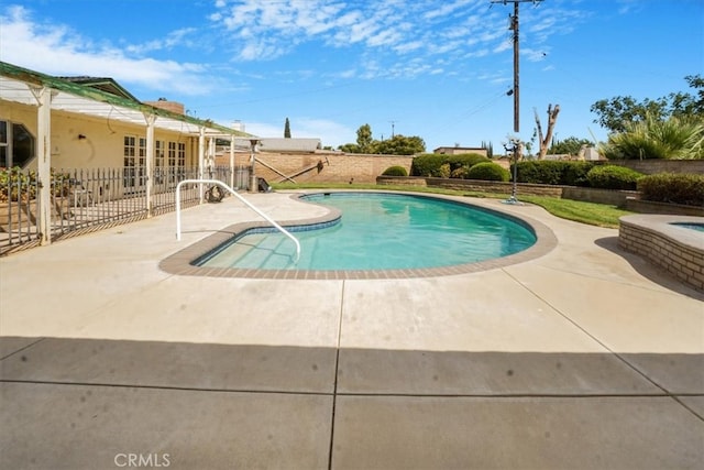 view of swimming pool with a patio area