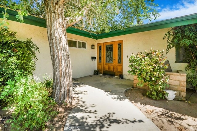 doorway to property featuring a patio area