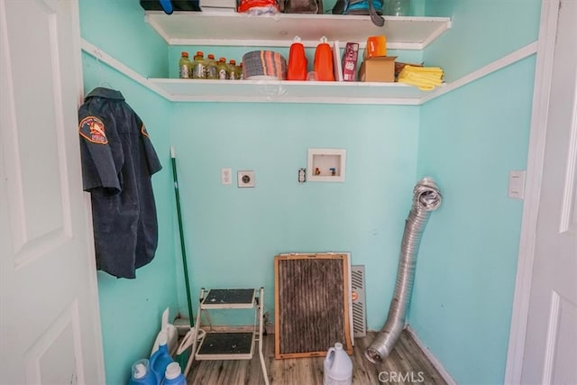 clothes washing area featuring wood-type flooring, washer hookup, and electric dryer hookup