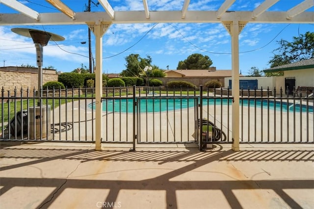 view of swimming pool with a patio area and a pergola