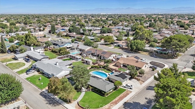 birds eye view of property with a mountain view