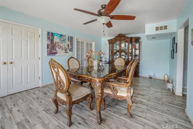 dining room featuring light hardwood / wood-style flooring and ceiling fan