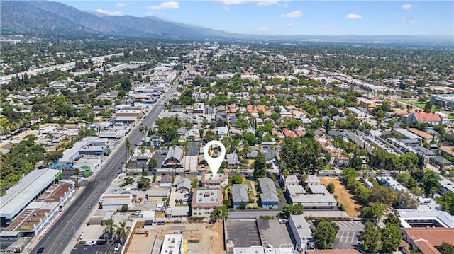 birds eye view of property with a mountain view