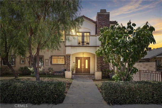 view of front of property with a balcony