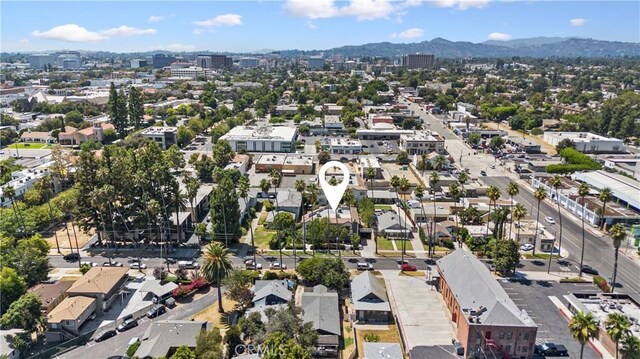 drone / aerial view featuring a mountain view