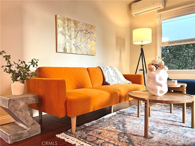 living room featuring a wall mounted air conditioner and wood-type flooring